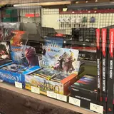 The Gilded Table, tienda de TCG en Homer