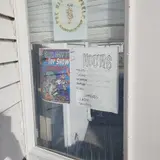 The Wizard's Shelf Games & Collectibles, tienda de TCG en Moline