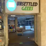 Unsettled Geeks, tienda de TCG en Manchester
